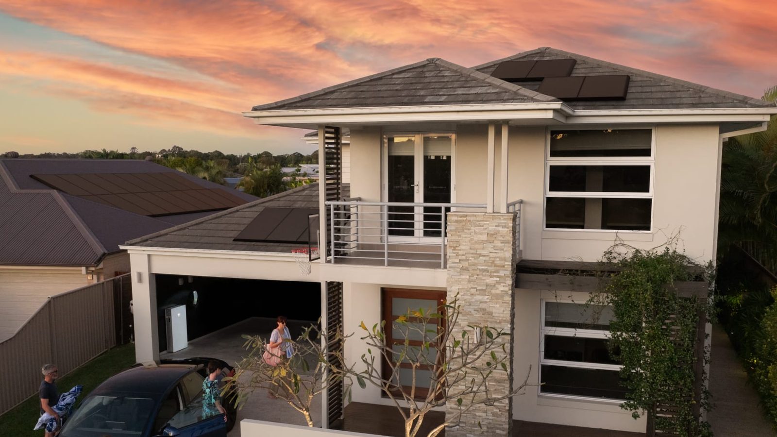 Rooftop solar panels and a home battery on an Australian house